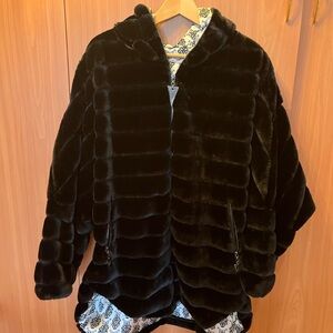Brand new ladies faux fur coat with a hoodie. Warm and soft. Color black.